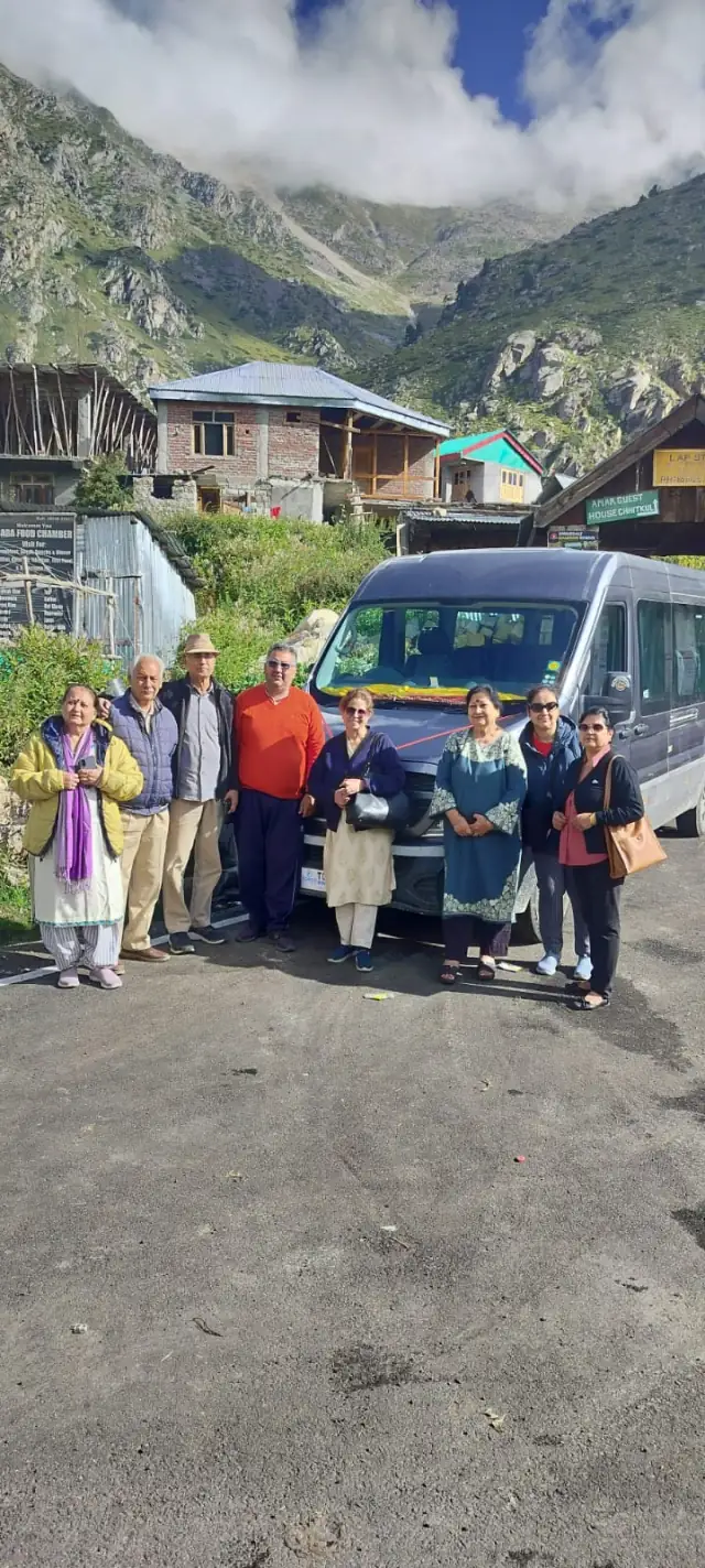 A group of our guests standing in front of the Gemini Urbania in a mountain village